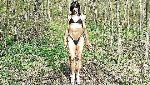 Amateur brunette in outdoor clothes is masturbating