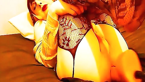 Brunette milf is fucked with her own big dildo in her pussy