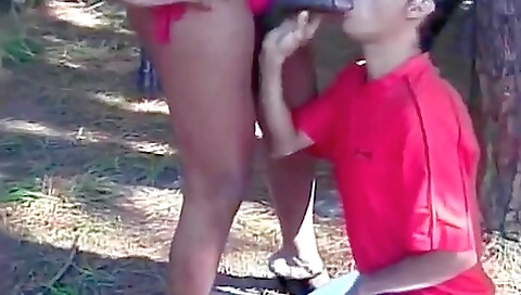 Ebony brunette with a sexy ass fucking a guy outdoors